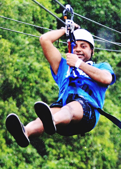 full-length-man-zip-lining-forest
